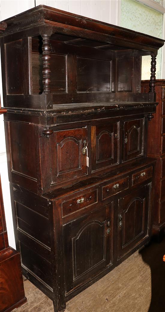 An 18th century oak tridarn, W. 4ft 4in. D. 1ft 9in. H. 6ft 4in.